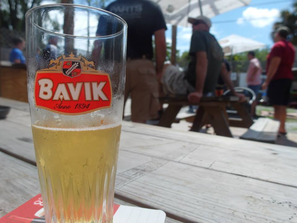 A glass of Bavik at Buster's Bistro during a petanque tournament